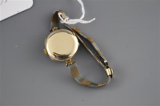 A ladys mid 20th century 14k, ruby and diamond set Precista manual wind dress wrist watch, on rolled gold and steel bracelet.